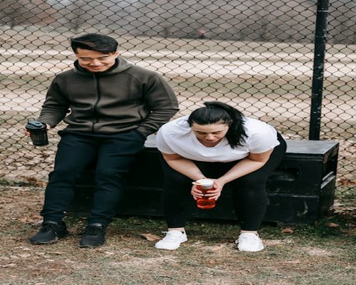 Person taking a break stretching in front of a window